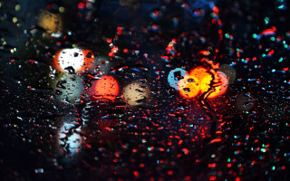 Rainy windshield city lights night - a close up of a rain free wallpaper