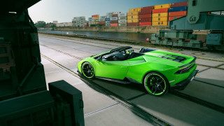 Green sports car driving cargo - the side of the road free wallpaper