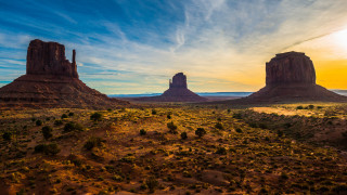 Desert rocks trees cloudy sky - a desert landscape free wallpaper for desktop