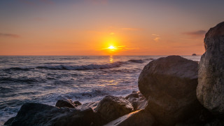 Sunset ocean rocks waves person 2 - rock free wallpaper