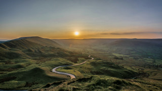 Winding road green valley sunset - a lush green valley free wallpaper for desktop