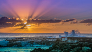 Sunset ocean lighthouse waves building - crepuscular ray free wallpaper