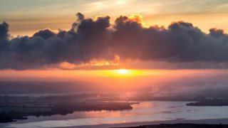 Sunset clouds water city horizon - a few building free wallpaper