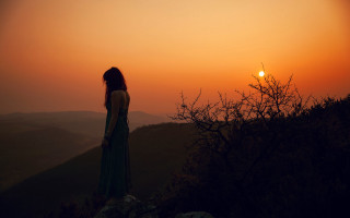 Woman hill sunset longhair mountain - the sun in the distance free wallpaper