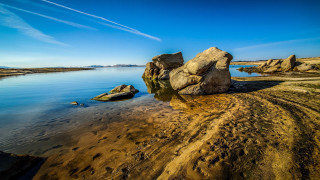 Large rock beach water sky - a sky in the background free wallpaper