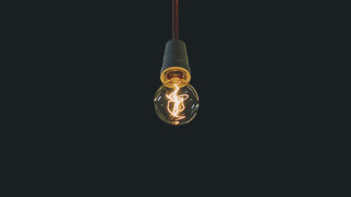 Lightbulb light inside black background - studio light free wallpaper for desktop