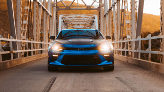 Blue cobra sports car bridge - cinematic focus free wallpaper