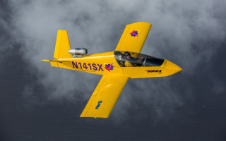 Yellow airplane cockpit cloudy sky - a cloudy sky free wallpaper for desktop