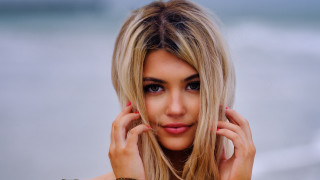 Blonde woman beach portrait photorealistic - a brown shirt free wallpaper