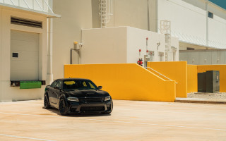 Black car yellow building white - a white door free wallpaper