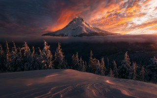 Snowy mountain forest sunset cloudy - the foreground and a sunset in the background free wallpaper