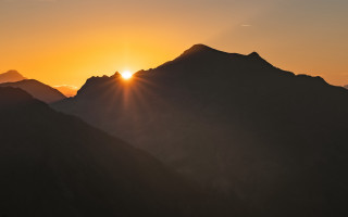 Sunset mountains bird cloudy sky - over the mountain free wallpaper
