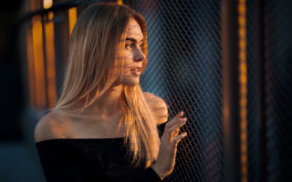 Woman fence serious blonde portrait - behind a fence free wallpaper