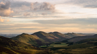 Valley mountains clouds greenhills sunset - a view of a valley free wallpaper