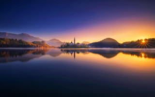 Lake church mountains sunset impressionist - a bright sun free wallpaper