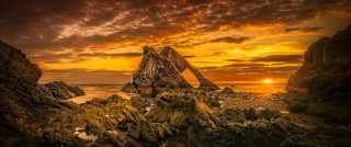 Beach sunset rock formation ocean - a rock formation free wallpaper