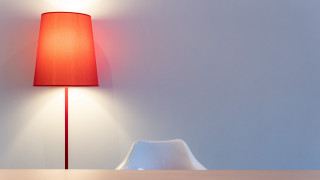 Red lamp wooden table white - a white chair free wallpaper