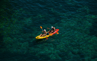Kitsch yellow kayak water paddle - the water and a boat free wallpaper