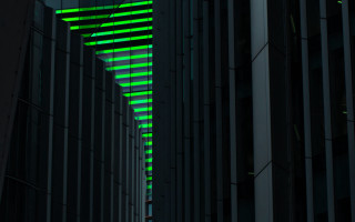 Cyberpunk building green light clock - the side of it free wallpaper