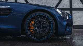 Blue sports car brick wall 2 - a blue sports car free wallpaper
