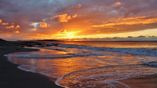 Sunset ocean waves beach dawn - the beach in the distance free wallpaper