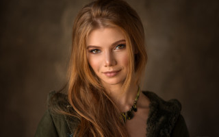 Woman longhair greenjacket portrait brownbackground - a green jacket free wallpaper for desktop