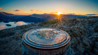 Sundial rock mountain lake landart - a mountain in the background and a lake in the foreground free wallpaper