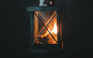 Small stove lit candle dark - a black table free wallpaper for desktop