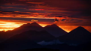 Sunset mountain range clouds lake - a sunset view of a mountain range free wallpaper