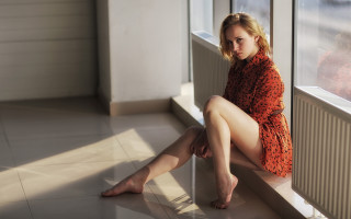 Woman sitting window sill blonde 2 - natural free wallpaper