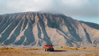 Red truck dirt road mountains - a red truck free wallpaper