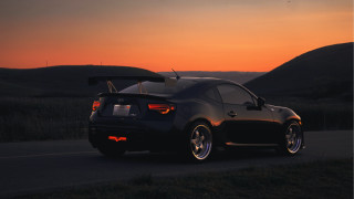 Car sunset hills backlit photorealistic - the side of a road free wallpaper for desktop