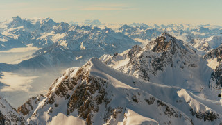 Mountain range view plane window - free winter wallpaper