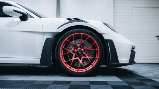 White sports car red rims 5 - a garage door open free wallpaper