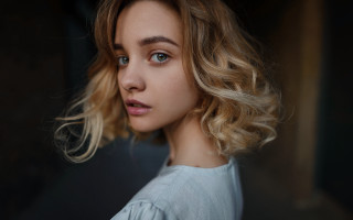 Blonde haired blue eyed serious - her face and shoulder free wallpaper