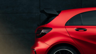 Red car wall black background - a red car free wallpaper