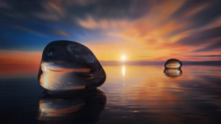 Floating objects sunset ocean reflection - top of a body free wallpaper