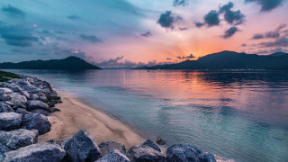 Beach rocks water sunset mountains - carl critchlow free wallpaper for desktop