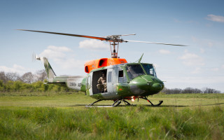 Helicopter man field trees sky - inside free wallpaper