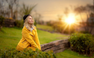 Woman yellow coat park sunset - a yellow coat free wallpaper