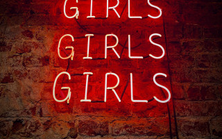 Neon sign girls brick wall - side of a building free wallpaper