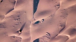 Snowy road footprints car land - footprint free wallpaper