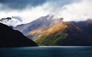 Mountain lake clouds boat night - a lake below free wallpaper