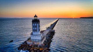 Lighthouse pier ocean sunset romanticism - radiant light free wallpaper for desktop