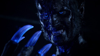 Blue eyed man black makeup - plastic free wallpaper