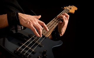 Man playing bass guitar black - his finger free wallpaper