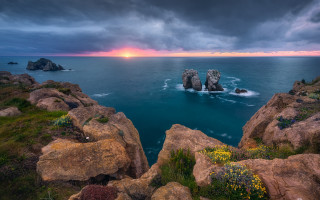 Rocky coastline sunset beach landscape - a rocky coastline free wallpaper