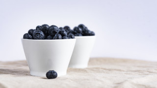 Blueberries white bowls tablecloth white - a white background behind them free wallpaper