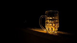 Beer glass dark backlighting art - a small amount of light free wallpaper