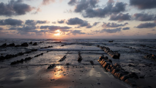 Sunset ocean rocks water clouds 7 - the foreground and a sky free wallpaper for desktop